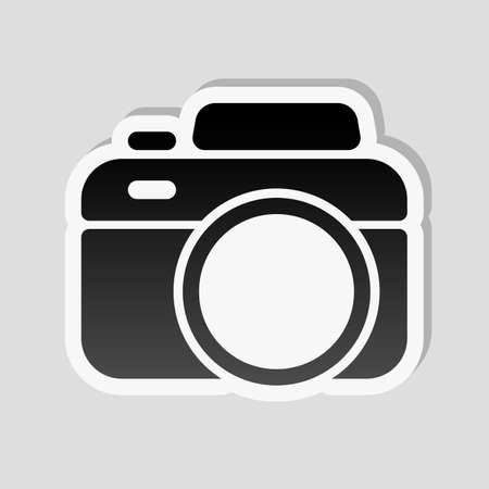 Photo camera, simple icon. Sticker style with white border and simple shadow on gray backgroundのイラスト素材