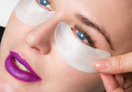 portrait of a girl with cosmetic patches under eyesの写真素材