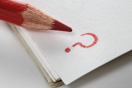 macro pencil and a question mark on a white page of the notebookの写真素材