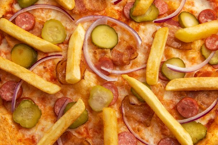 detail of pizza with potatoes close-up. macro pizza. good background for pizzeria. restaurant menuの写真素材