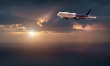 the plane of rainbow color flies in the stormy sky with the evening light of the sun. the plane flies over the dark seaの写真素材