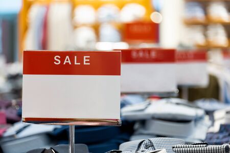 goods in stores and a red sign on sales discounts. mocap for text and concept of sales and trade in light industryの写真素材