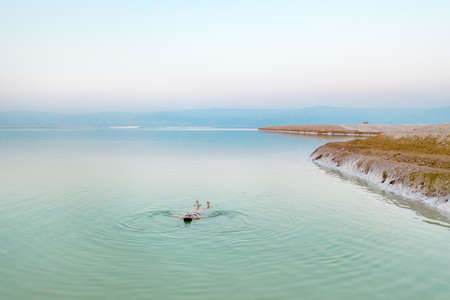 woman bathes in twoman bathes in the dead sea. Aerial view he dead sea. Aerial view. High quality photoの写真素材