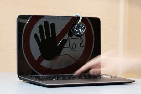 Lock at Notebook. Concept of stopping tinternet crime.の写真素材