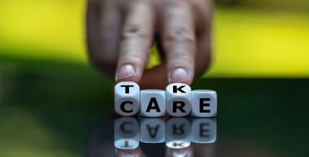 Dice form the expression "take care".の写真素材