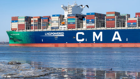 The LNG-powered containership, the CMA CGM Louvre, on the river Elbe near the city of Hamburg,...