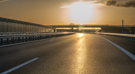 Driving into the sun at a German autobahn. Symbol for the danger of looking into sunlight while...