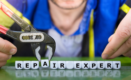 Dice form the expression 'repair expert' in front of a handyman.の写真素材