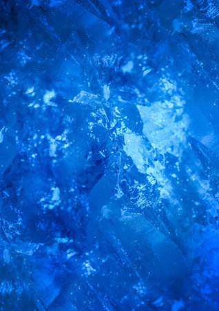 Texture cold frozen ice on a blue background
