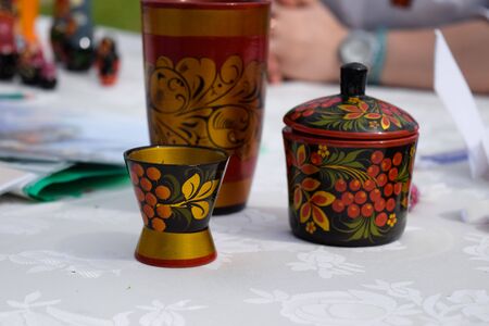 A wooden painted glass and a sugar bowl on the table. Russian Artの写真素材