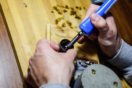 Repair of acoustic dynamics, ration soldering wire on the speaker. Nickel cobalt speaker 25gd-26の写真素材