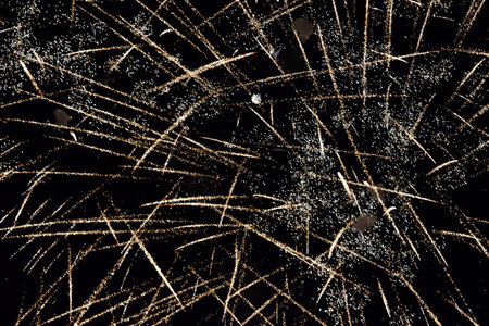 Festive salute in the night sky. Explosions of fireworks and pyrotechnics in the sky.