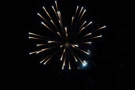 Festive salute in the night sky. Explosions of fireworks and pyrotechnics in the sky.の写真素材