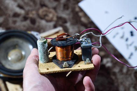 Acoustic filter in a music column. Electrical circuit of a magnetic coil, capacitor and resistance....