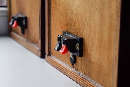 The back of the speakers. Terminals for attaching speaker wires to the speaker. Column speaker 15AS-208. Vintage Soviet bookshelf acoustics.の写真素材
