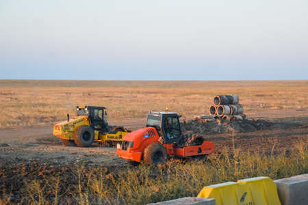 Taman, Russia - June 7, 2019: A Road roller for ramming the roadway. Road roller on the construction of the road.のeditorial素材
