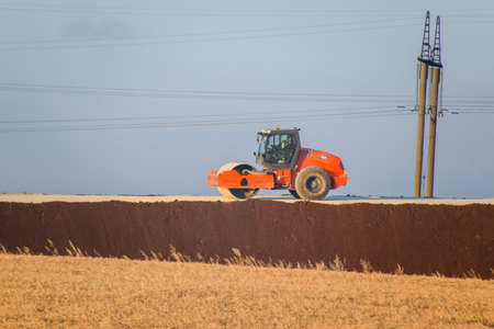 Taman, Russia - June 7, 2019: A Road roller for ramming the roadway. Road roller on the construction of the road.のeditorial素材