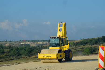 Taman, Russia - June 7, 2019: A Road roller for ramming the roadway. Road roller on the construction of the road.のeditorial素材