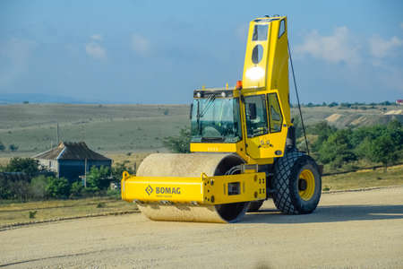 Taman, Russia - June 7, 2019: A Road roller for ramming the roadway. Road roller on the construction of the road.のeditorial素材
