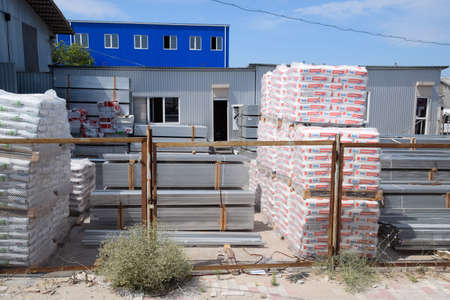 Taman, Russia - June 9, 2019: Warehouse of building materials. a Building base, metal, wood and blocks with bricks.のeditorial素材