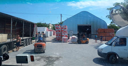 Taman, Russia - June 9, 2019: Warehouse of building materials. a Building base, metal, wood and blocks with bricks.のeditorial素材