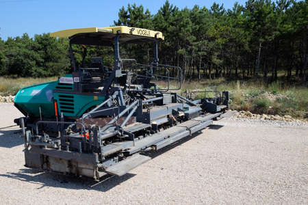 Taman, Russia - July 9, 2019: Techniques for the construction of the road. Asphalt dispenser.のeditorial素材