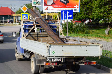 Taman, Russia - July 9, 2019: Carrying metal products on a truck. Metal profile delivery.のeditorial素材