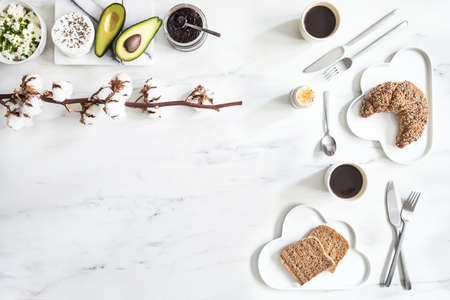 Enjoy healthy breakfast. Top view of different vegetarian food on the white marble table background.の写真素材