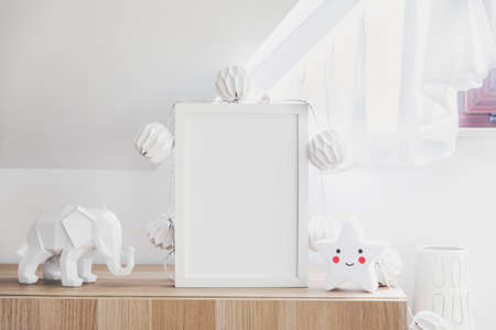 The modern sandinavian newborn baby room with mock up poster frame, cotton lamps and star. Sunny and bright interior.の写真素材
