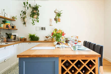 Fresh summer breakfast in Mediterranean style kitchen. Bright and sunny space with a lot of herbs...