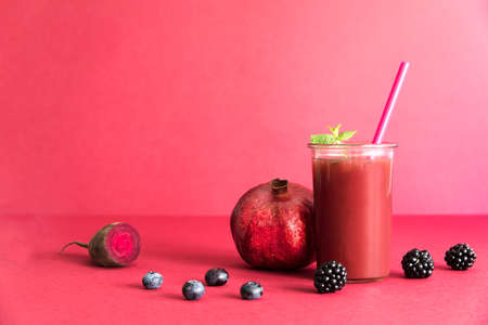 Healthy red smoothie with red vegetables and fruit lie on the table. Detox diet for healthy body and mind.の写真素材