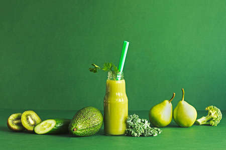 Green composition of vegetables and fruits for detox juice diet. Healthy lifestyle.の写真素材