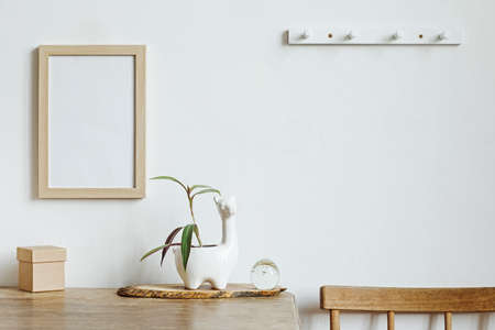The stylish interior with mock up photo frame, lama pot and small box.The minimalism concept of space.の写真素材