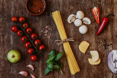 Stylish composition of fresh, italian ingredients and food on the vintage wooden table. Culinary backgrounds. Top view.の写真素材