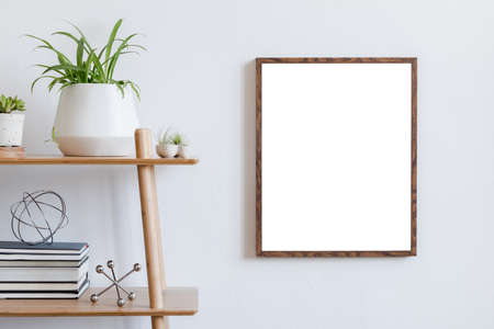 Scandinavian room interior with mock up poster frame on the brown bamboo shelf with beautiful plants...