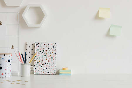 Modern and stylish home interior with elegant office accessories, notes, memo sticks, pencils and organizer. Scandinavian home decor. Minimalistic concept. Template. Copy space. Real photo.Home officeの写真素材