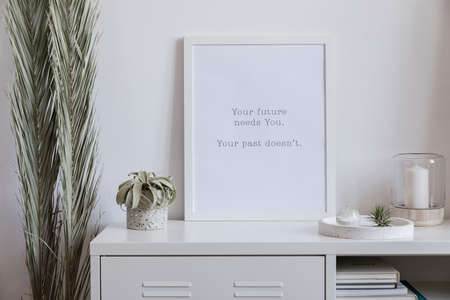 The nice scandinavian interior of living room with white mock up poster frame, air plant, palm...