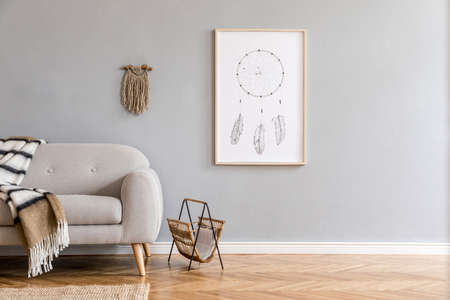Minimalistic and design home interior of living room with gray sofa, newspaper holder, macrame,...