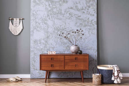Boho style living room with retro commode and vase with flowersの写真素材