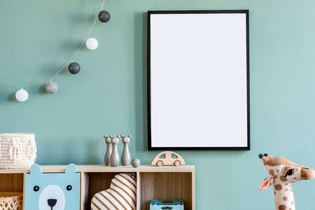 Stylish scandinavian newborn baby room with wooden cabinet, toys, mock up poster frame and...