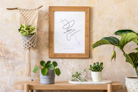 Stylish scandinavian interior of living room with mock up poster frame, wooden console, plants,...