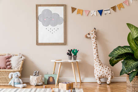 Stylish scandinavian kid room with mock up poster, toys, teddy bear, plush animal, natural pouf and children accessories. Modern interior with beige background walls. Template. Design home staging.の写真素材