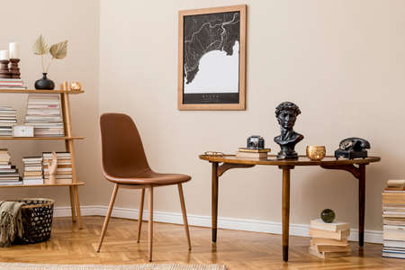 Stylish interior design of private library room with mock up poster map, brown chair, wooden table,...