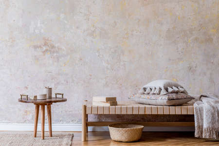 Minimalistic composition of oriental living room with chaise longue, small wooden coffee table,...