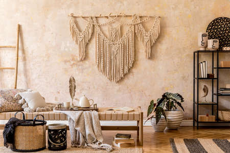 Interior design of stylish living room with chaise longue, beautiful macrame, rattan decoration,...