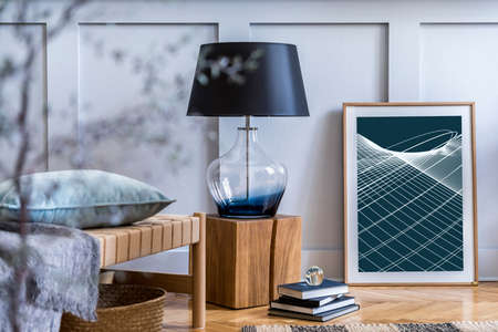 Interior design of scandinavian living room with modern chaise lounge, plaid, wooden cube, books, lamp, mock up poster map and elegant personal accessories in stylish home decor.の写真素材