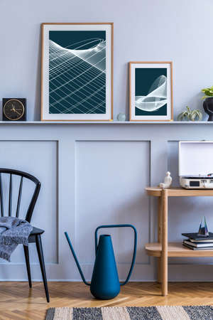 Stylish scandinavian living room interior with design black chair, wooden console, air plants, book, decoration, mock up poster frame on the shelf and elegant accessories in modern home decor.の写真素材