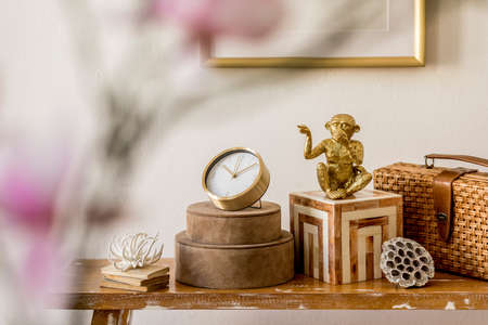 Modern composition of stylish accessories, decoration, flowers on the wooden bench at white living...