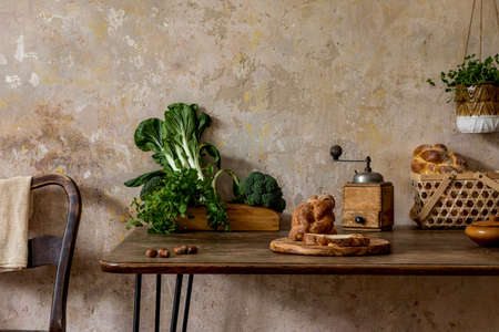 Stylish composition of kitchen interior with family table, vegetables, tea pot, dessert, food...