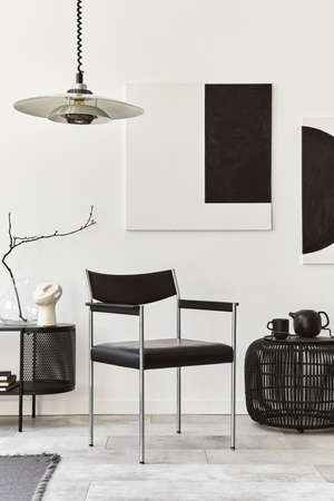 Interior design of modern living room with black stylish commode, chair, mock up art paintings,...